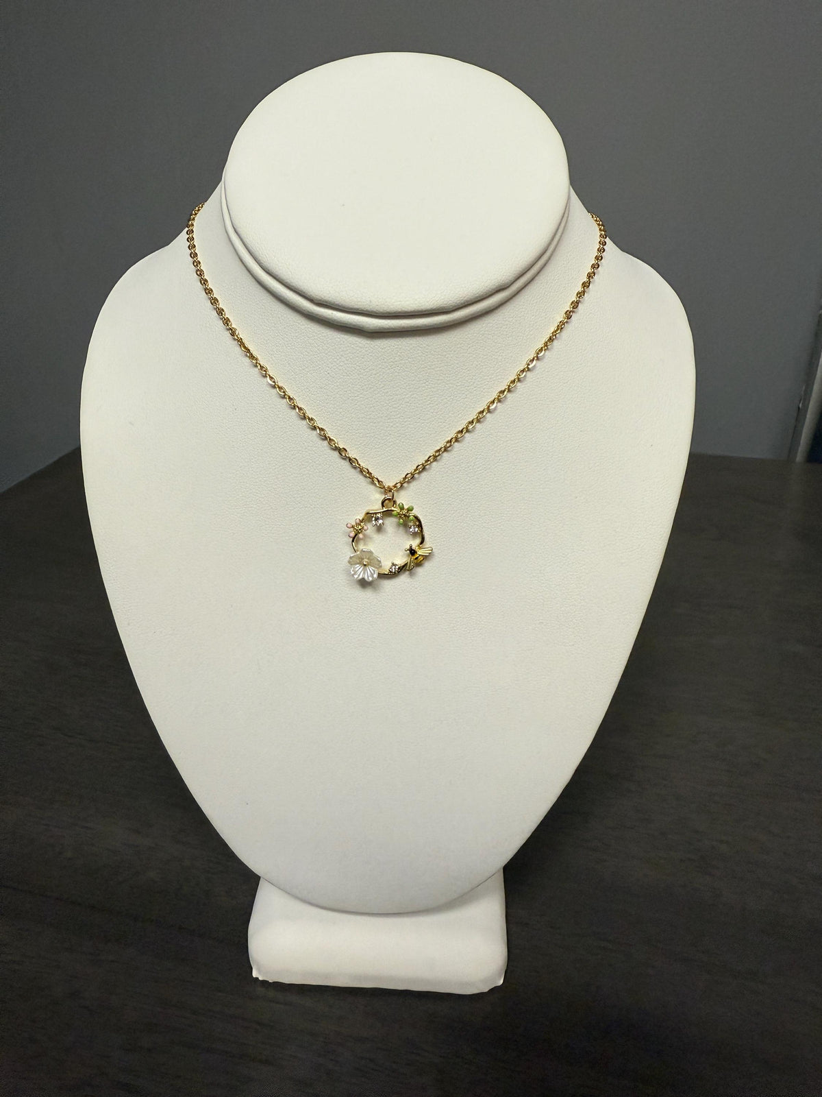 bee and flower necklace with an 18 inch gold plated chain