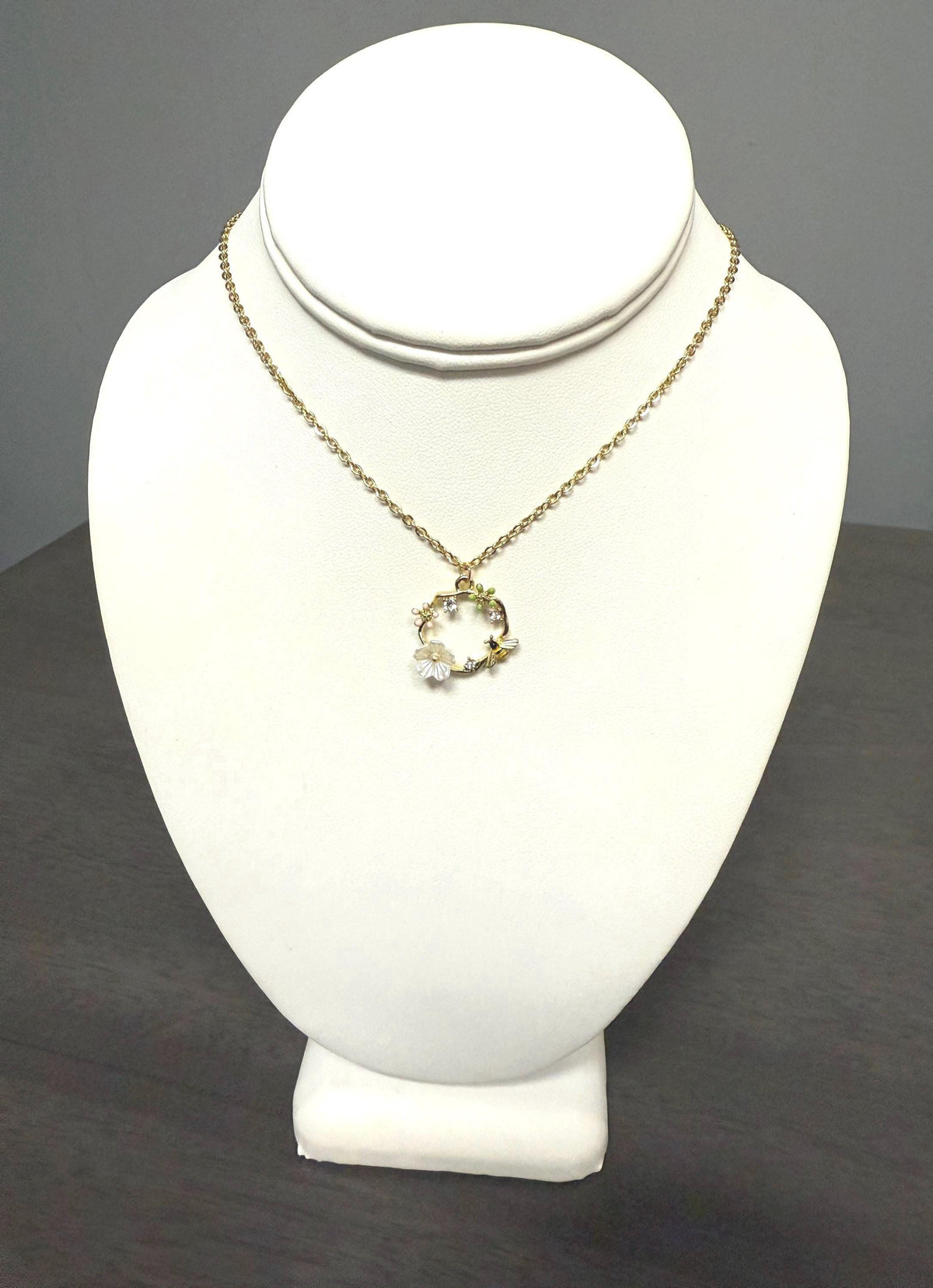 bee and flower necklace with an 18 inch gold plated chain